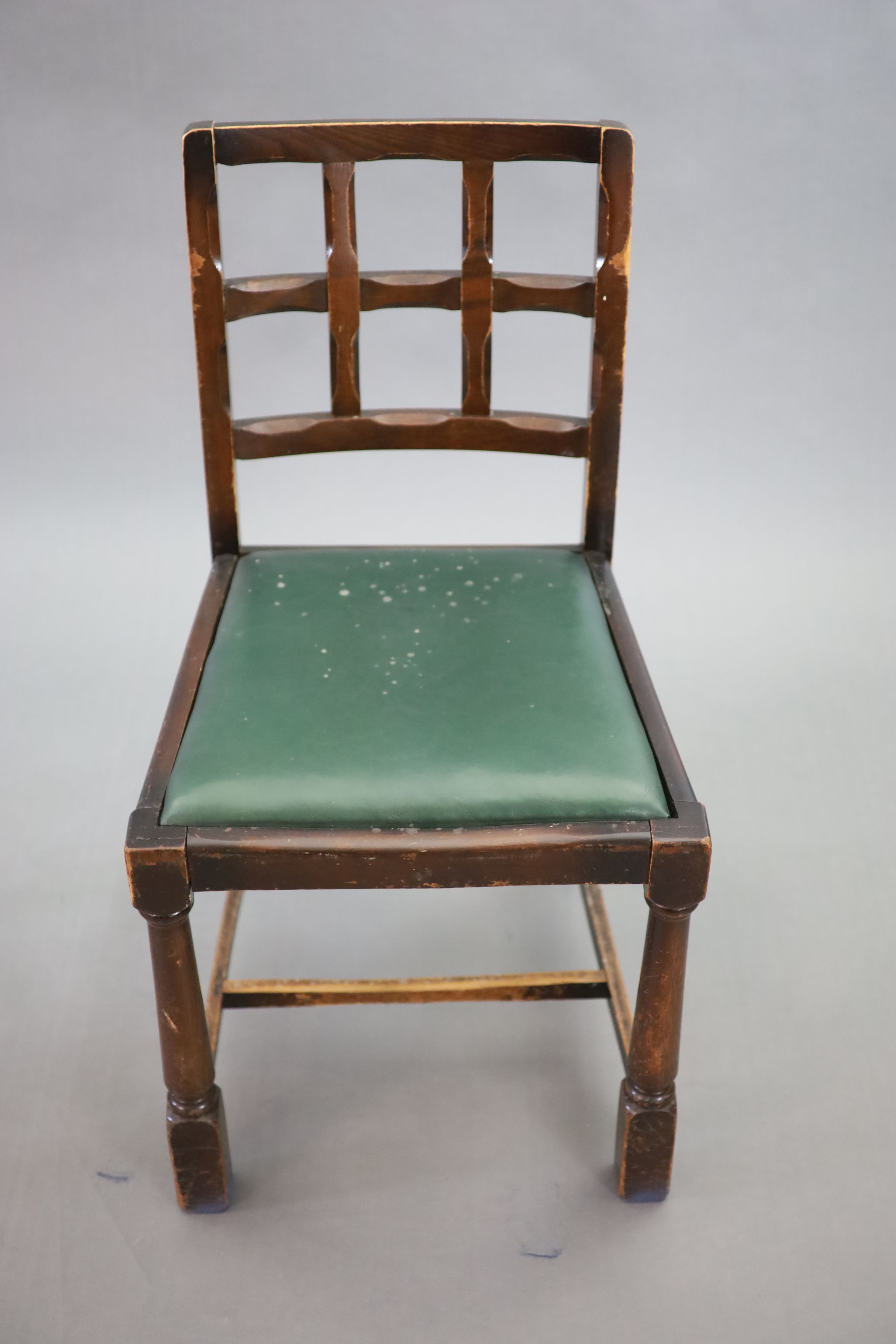 A set of eight early 20th century oak and beech dining chairs